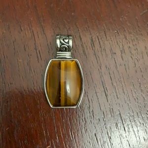 Tigers eye pendant set in silver rhodium